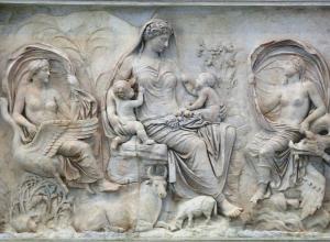 The so-called Tellus panel from the Ara Pacis, ca 9 BCE. Here a goddess, likely the personification of Pax (Peace) or Tellus (the Earth), is surrounded by natural fecundity and symbols of plenty. This panel combined with the other mytho-historical images of the building are an imagery combination of commemorative Roman art. The Ara Pacis has been reassembled in the Museo dell’Ara Pacis in Rome. 