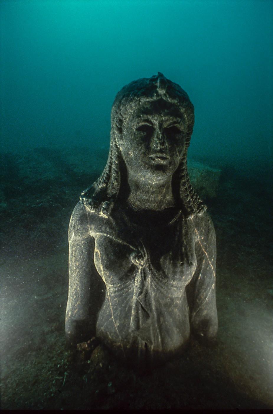 Bust of the black stone queen set up underwater on site, Heracleion, Egypt