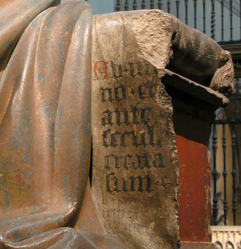 Detail of Biblical script in sculpture by Claus de Werve, Virgin and Child, c. 1415 - 17. Limestone with paint and gilding. 53 3:8 x 41 1:8 x 27 in. The Met. Rogers Fund, 1933. 33.23