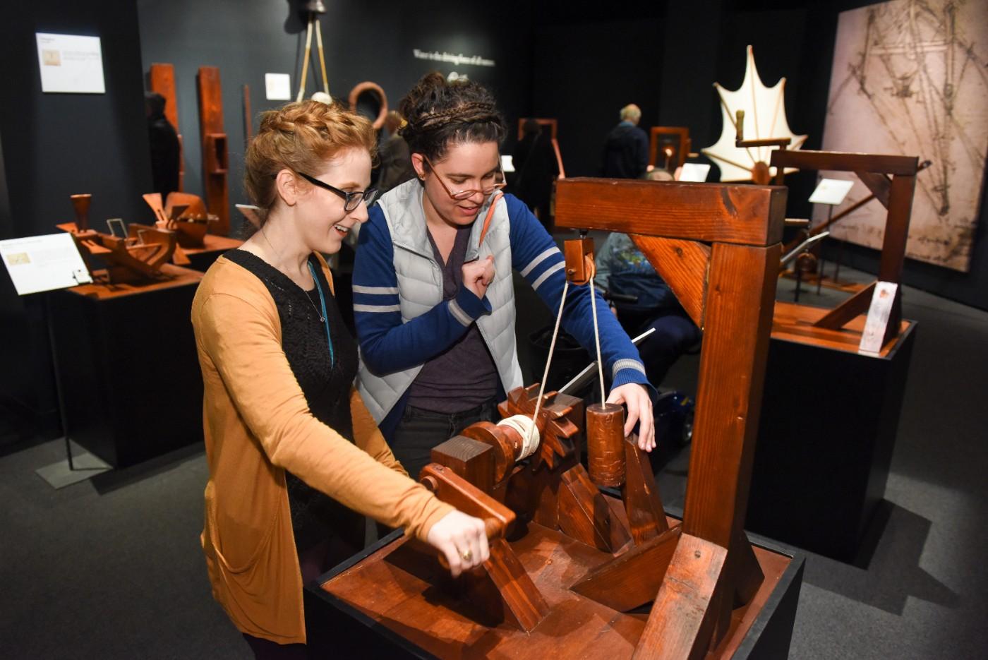 Visitors explore interactive models of da Vinci's inventions.