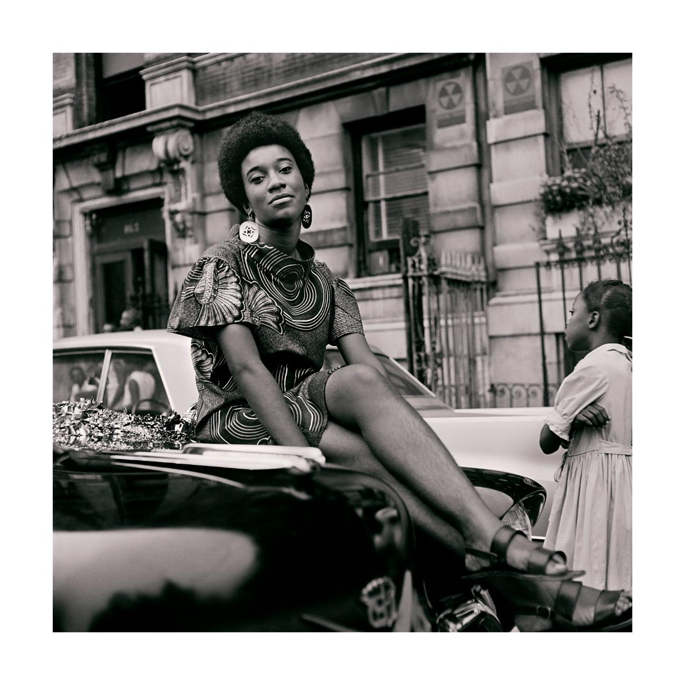 Kwame Brathwaite. Grandassa Model on car during Marcus Garvey Day celebration, Harlem, ca. 1968.