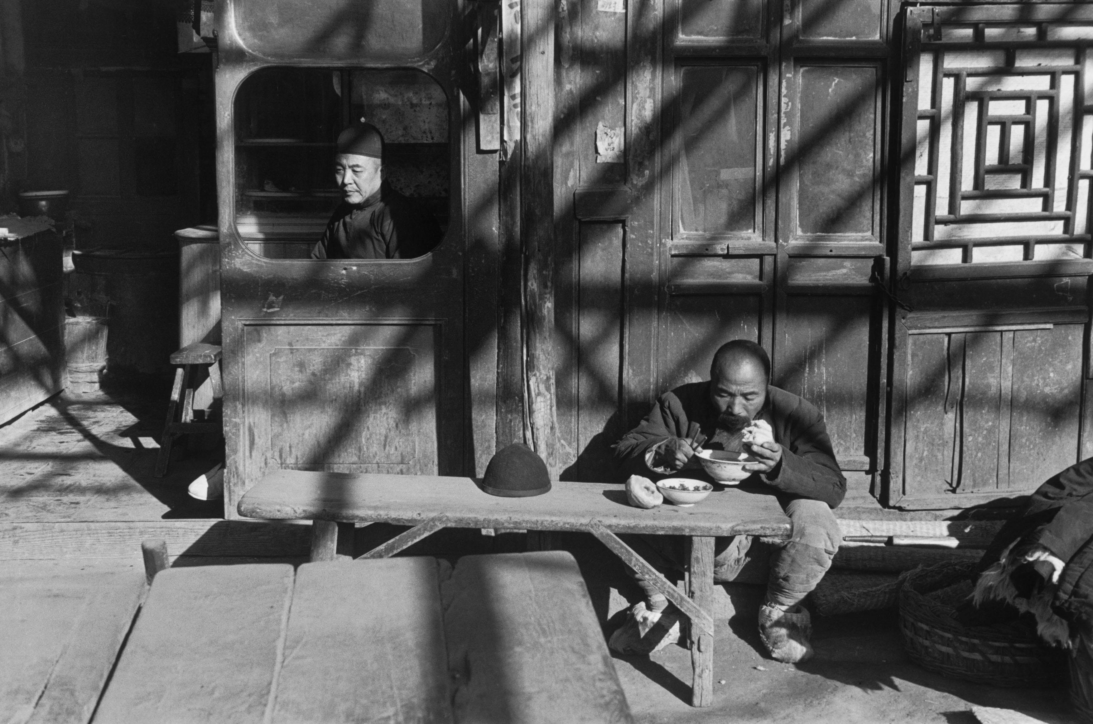 At the entrance to a tavern, Beijing, December 1948.