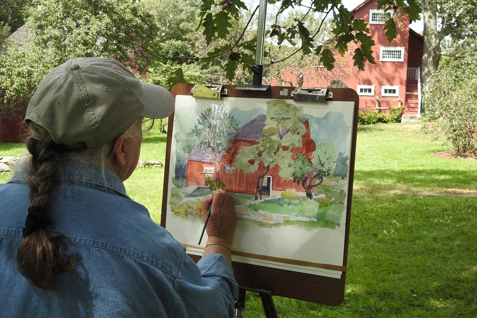 Bobbi Eike Mullen, a contemporary artist, paints at Weir Farm and instructs the park’s free art classes.  