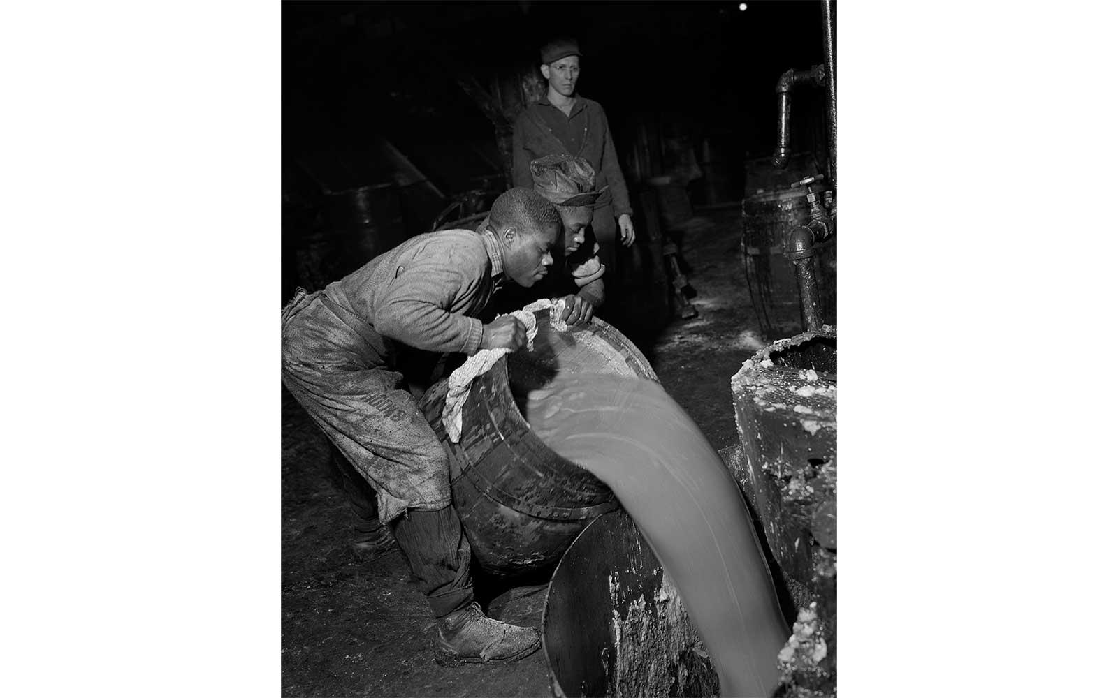 Gordon Parks, Charging a kettle where lime-based greases are made. Left to right: Samson Davis, Ernest Matthews, Thomas J. Moran, March 1944.