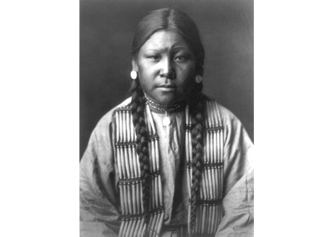 Cheyenne girl, half-length portrait, facing front, 1905.