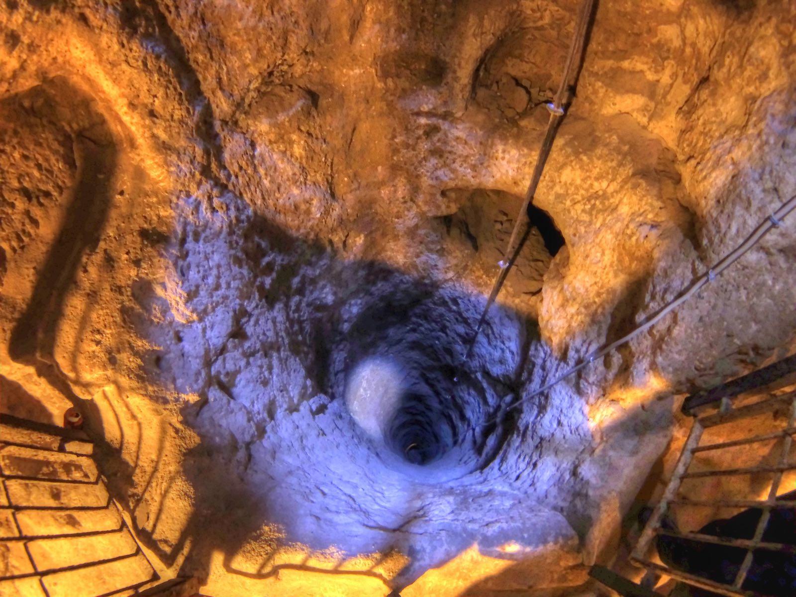 Underground City in Cappadocia, Turkey. Christians fled the enemies and hid in this underground cities. All digging starts with a ventilation well and afterwards city expands horizontally.