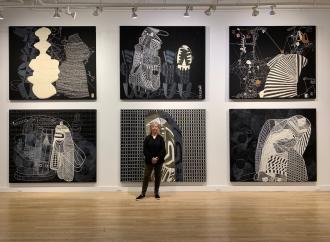 Sarah Amos in front of "Sarah Amos: Chalk Lines" at CUE Art Foundation