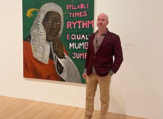 Jeffrey Magid standing in front of Henry Taylor's / was King When I Met the Queen, Syllable x Rythm Equals Mumbo Jumbo, 2013.