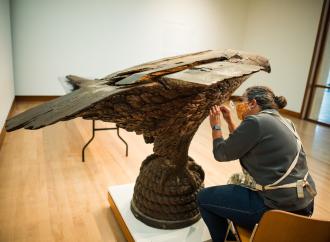 Pizzagalli Director of Conservation Nancie Ravenel at work conserving folk art sculpture by Laban Smith Beecher from the mid-19th century. Photography by Andy Duback
