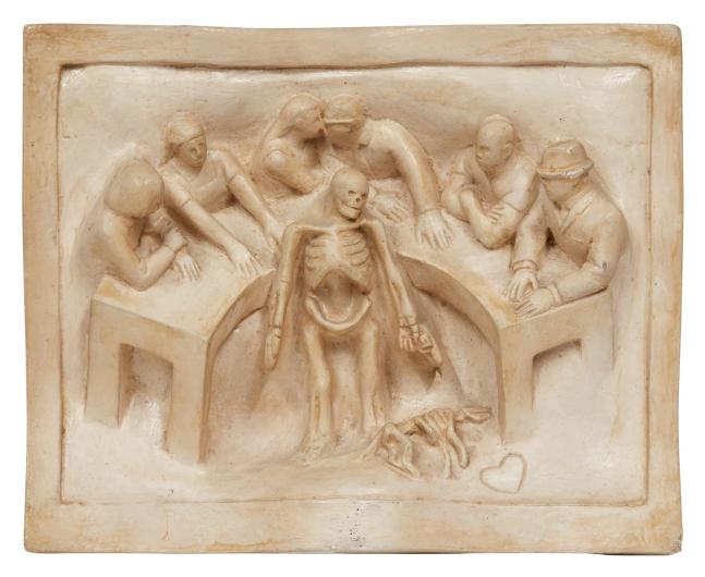 Tom Otterness bas relief sculpture of figures at a table with a skeleton