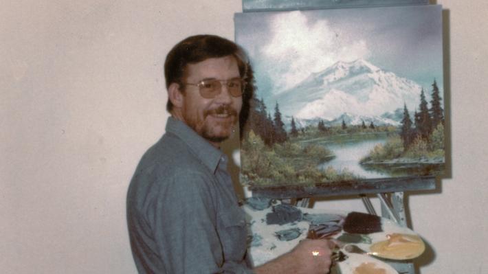 2 Bob Ross- Happy Accidents, Betrayal & Greed - Production Still Featuring early photo of Ross painting. 