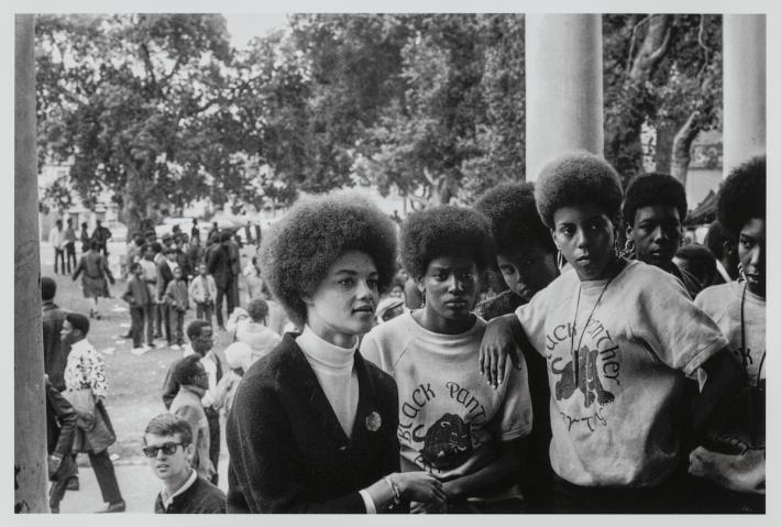 Oakland, California: Kathleen Cleaver; Communications Secretary and first female member of the Party’s decision-making Central Committee, talks with Black Panthers from Los Angeles who came to the *Free Huey* rally in DeFremery Park (named by the Panthers Bobby Hutton Park) in West Oakland, July 28, 1968. Stephen Shames (American, born 1947). Photograph, archival pigment print. Gift of Lizbeth and George Krupp. © 2023, Stephen Shames. Courtesy Museum of Fine Arts, Boston.