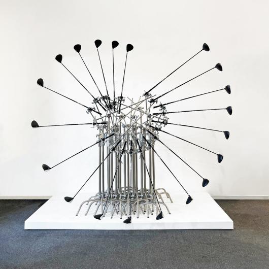 Mauricio Alejo, The Unfathomable Illusion that Eternity Exits II, 2024. Stainless steel metal clamps and golf clubs, 305 x 254 x 208 cm. 