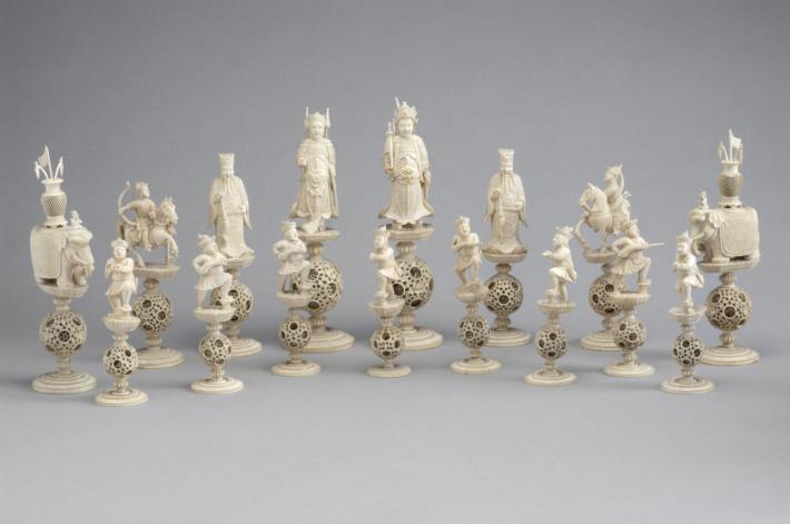 white chess pieces featuring dragons