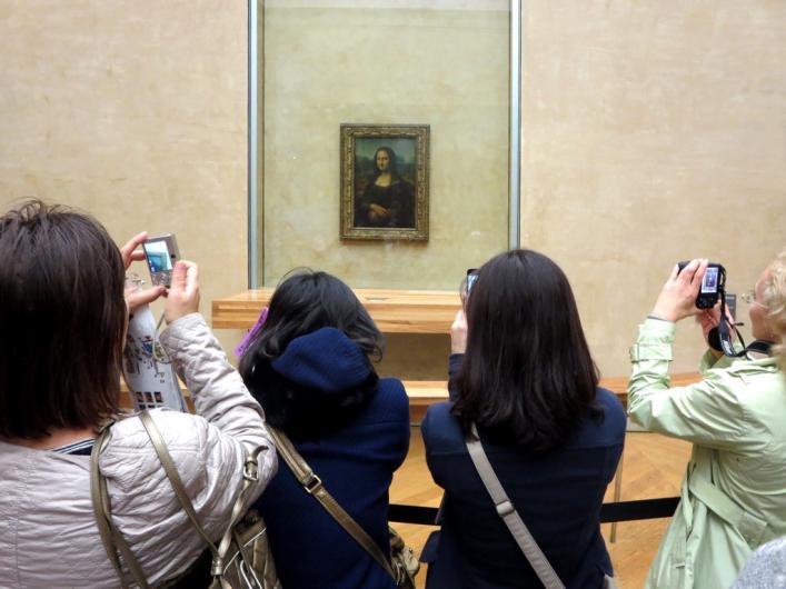 Close view of the Mona Lisa at the Louvre in 2015. Photo by David Stanley. Courtesy Flickr.