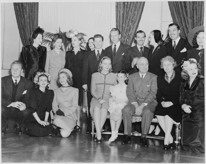 A gaggle of socialites and film stars pictured with President Harry Truman and family at the White House. Founder of the Met Gala Eleanor Lambert stands in the back row, second from the left end.
