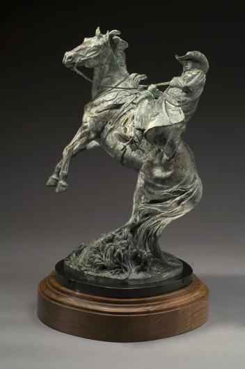 Harold T. Holden bronze sculpture of a rearing horse with a cowboy on its back