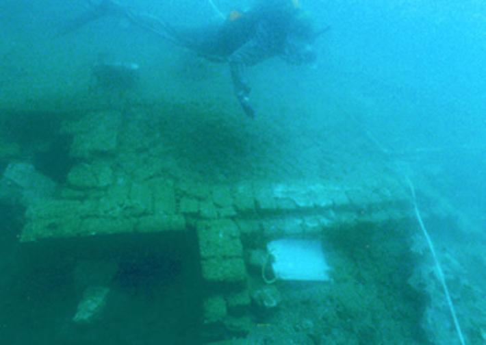  A diver hovers over and takes notes on a portion of the sunken city of Port Royal, Jamaica.