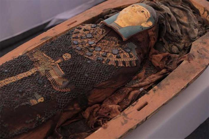 One of the mummies within a sarcophagus recently excavated from the newly discovered cemetery at Tuna al-Gebel in central Egypt. Credit: Egyptian Ministry of Tourism & Antiquities. 