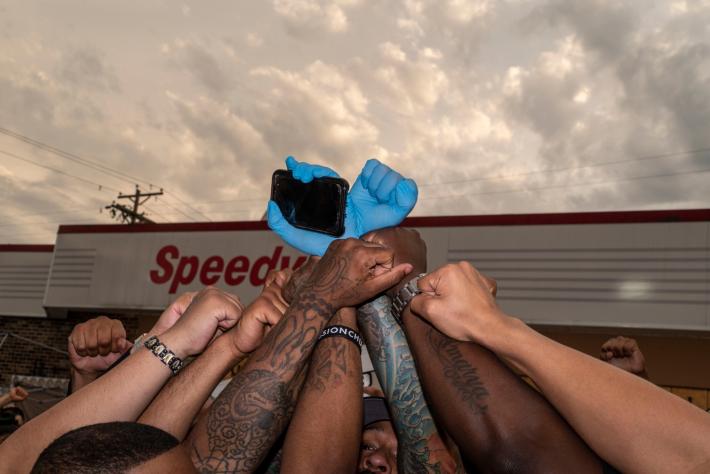 PETER VAN AGTMAEL photograph of fists raised together