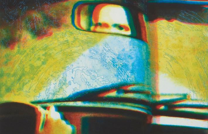 Tom McGrath print of eyes seen in a rearview mirror of a car