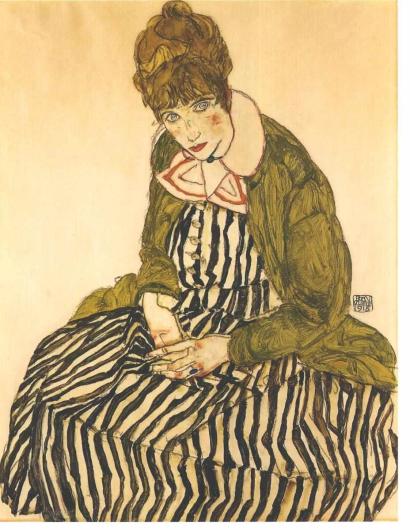 Egon Schiele portrait of Edith Shiele, in a black and white dress, seated on the floor, with a green sweater