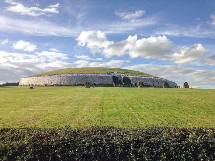 View of primary mound at Newgrange. Wikimedia Commons. Photo by Tjp finn.