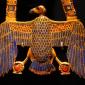 egyptian pectoral amulet in the shape of a vulture, made in gold with lapis lazuli inlay